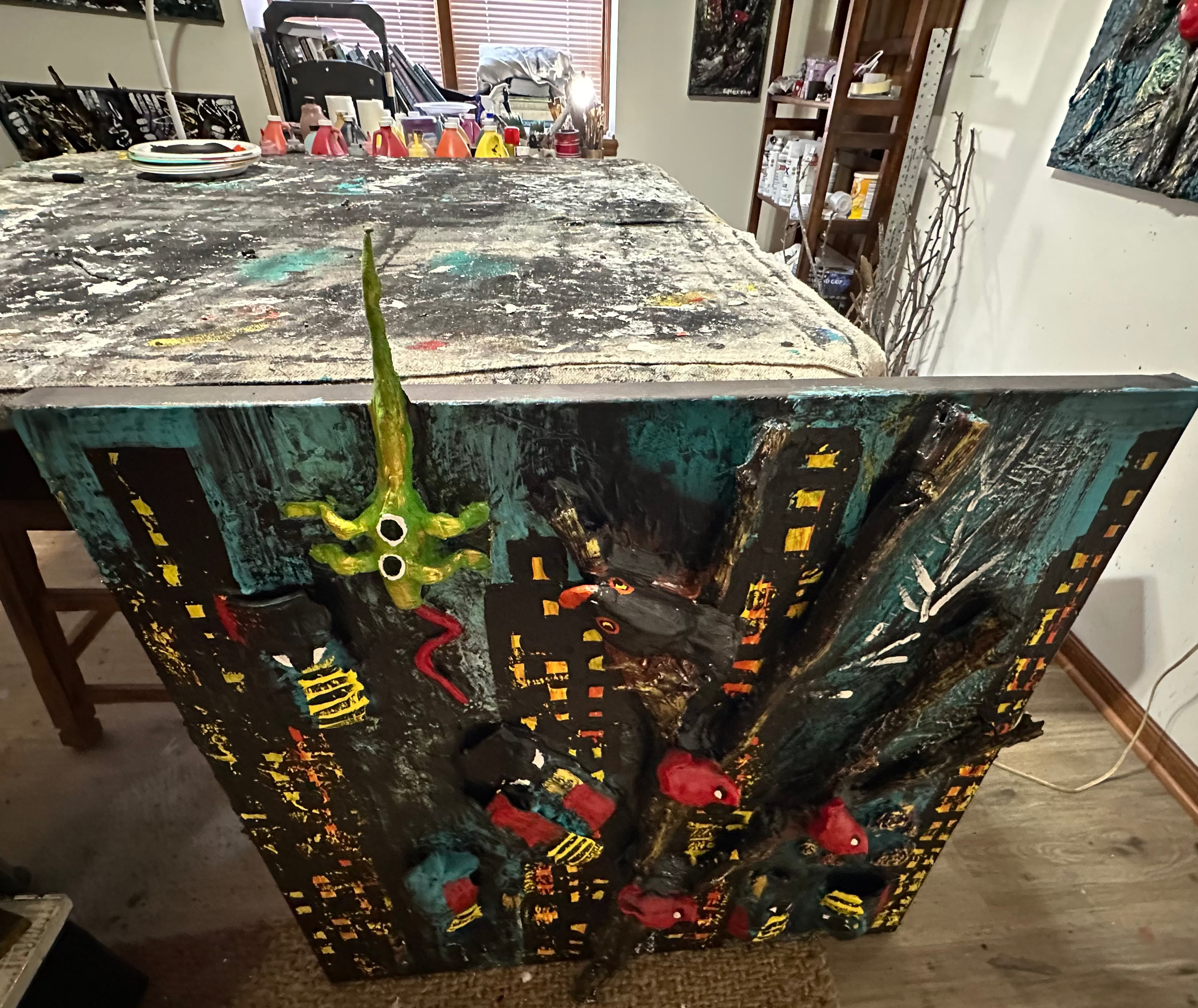 Artistic table with cityscape design and colorful elements in a room setting